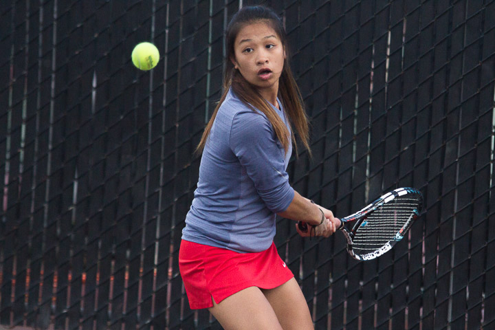 Rams sophomore Elsie Woo reaches out for a backhand shot against Santa Rosa Junior College in a tennis match on Thursday, Jan. 30, 2014, at Ocean campus. Photo by Khaled Sayed/The Guardsman