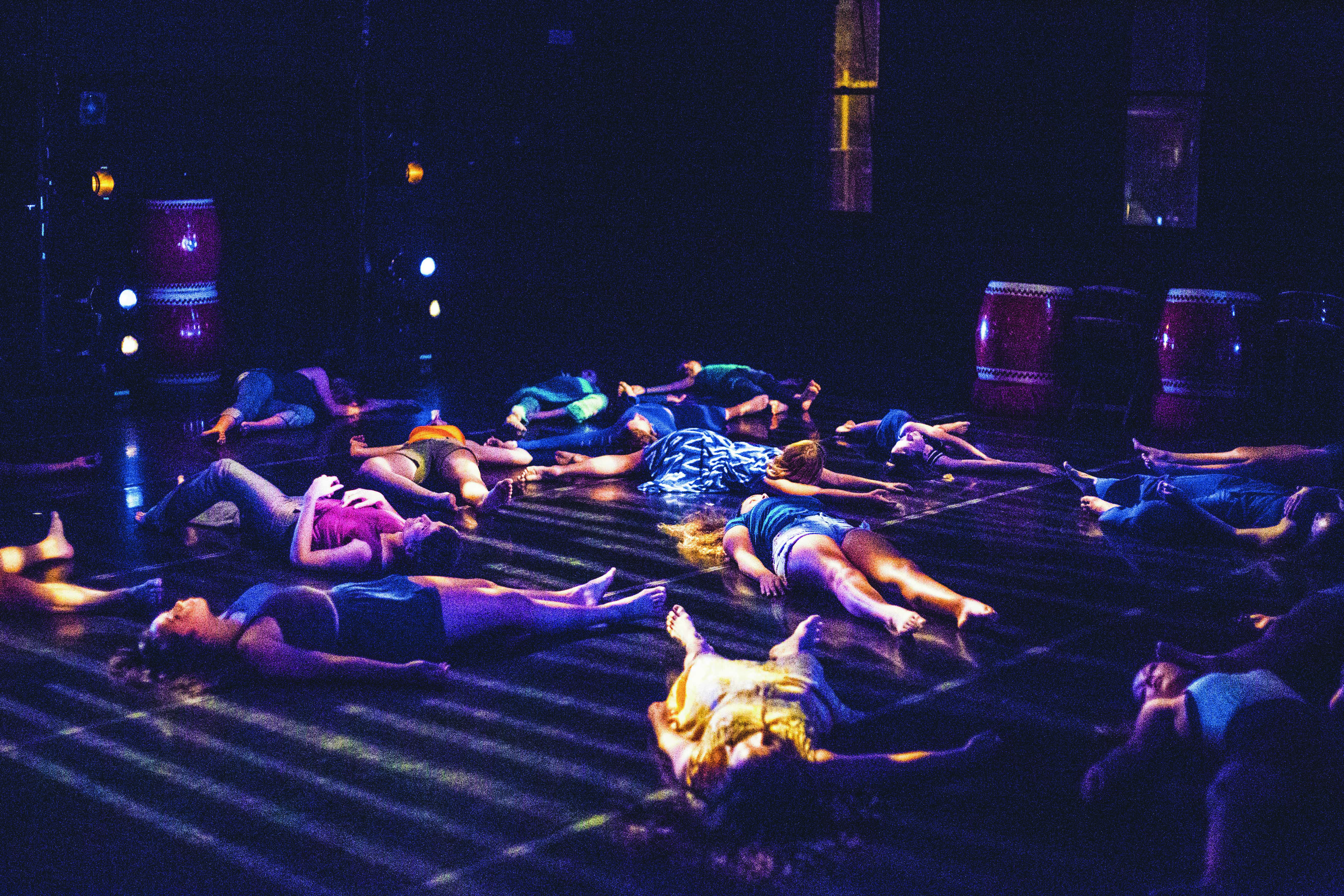 In one of the last moments of the show, the performers fall to the floor. (Photo by Elisa Parrino) 