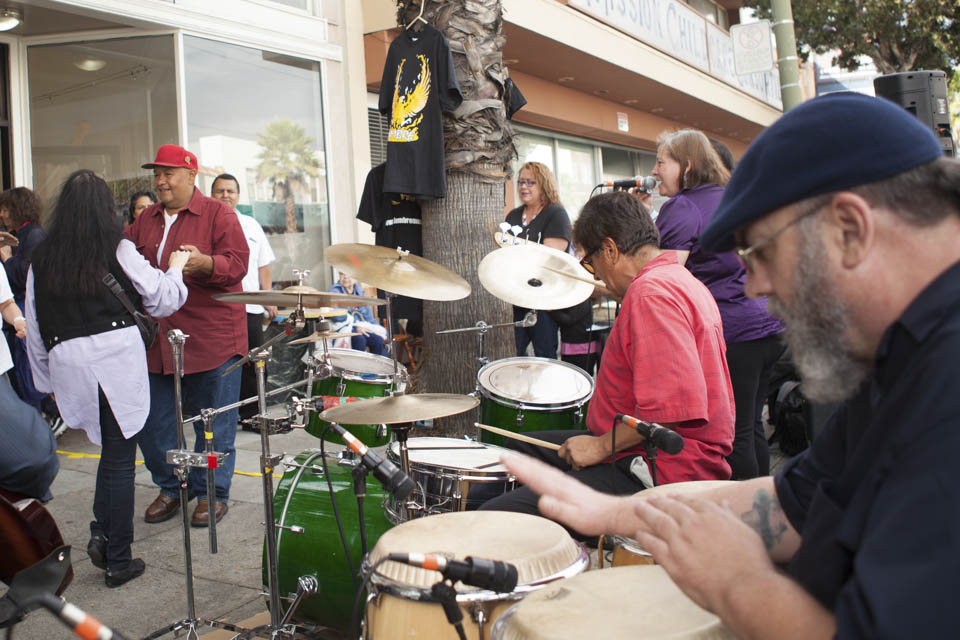 A music band ‘Adelante’ performs live salsa and Latin jazz for the audience in front of Mama’ Art Cafe on Mission Street during Sunday Streets Festival in Excelsior, San Francisco on Sunday, Sept. 28, 2014 (Photo by Ekevara Kitpowsong)