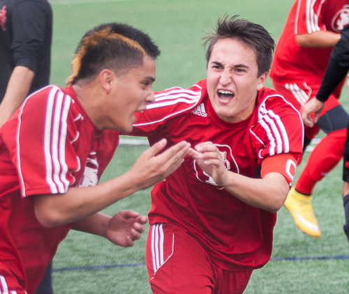 Andy Altamirano (left) celebrates with his teammate after he scores the game tying goal. (Santiago Mejia)