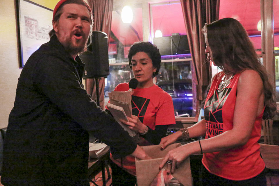 Bryden White (left) pulls raffle tickets during the shows afterparty. (Photo by Natasha Dangond)