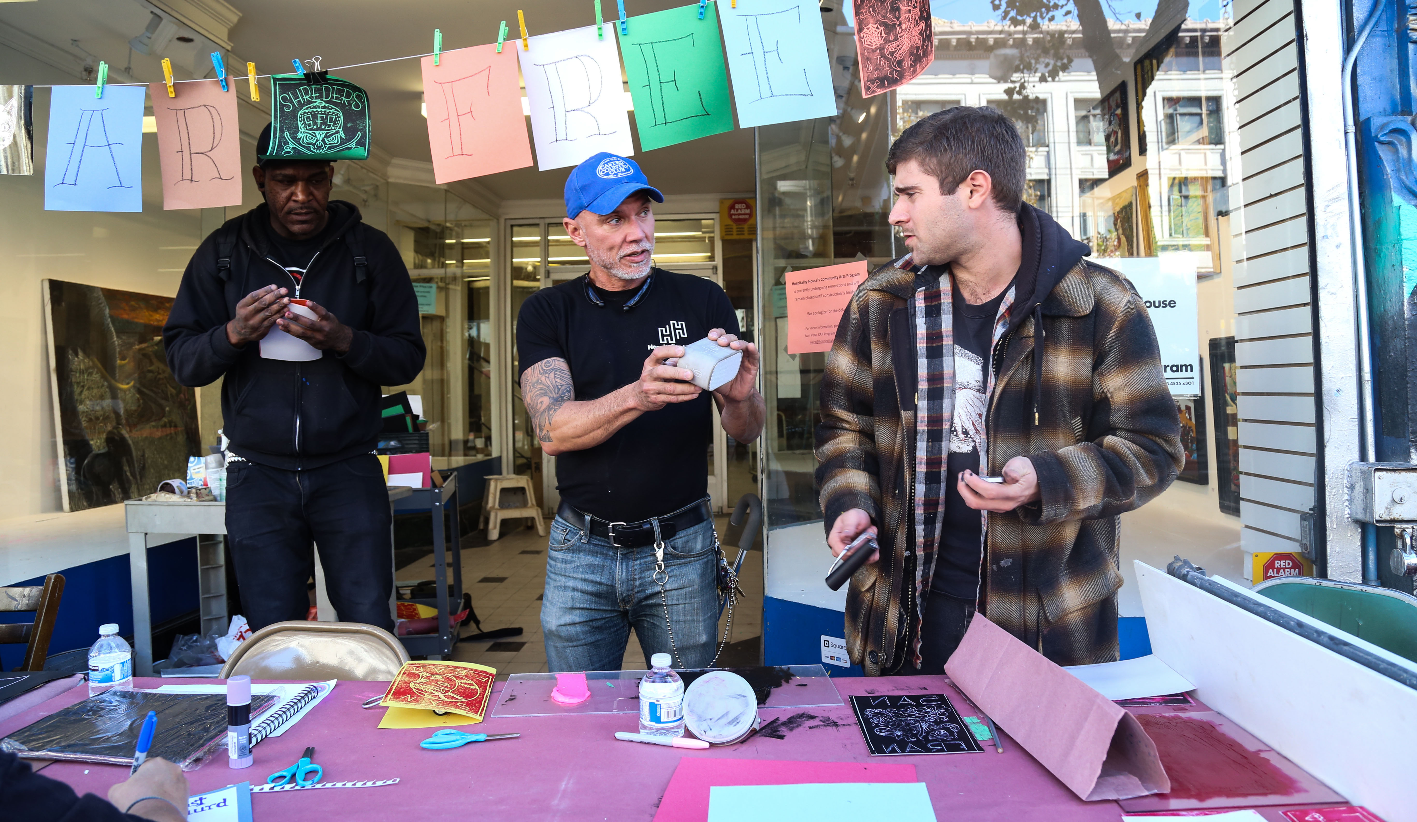 Studio Manager and City College student Ivan Vera, left, and CAP ceramics instructor Josh Reinstein, right, set up art supplies at a table outside the studio at 1009 Market St. Friday Nov. 7, 2015. (Photo by Natasha Dangond/The Guardsman)
