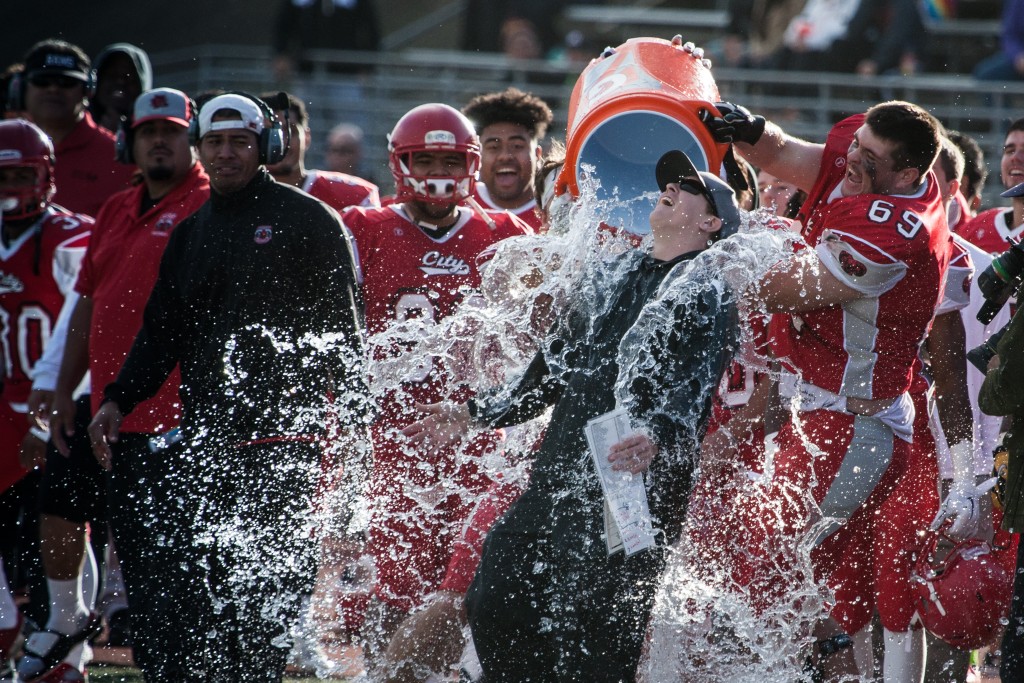City College players dump a cooler of water over head coach Jimmy Collins to celebrate winning the California State Athletic Conference against Saddleback College on Dec. 12, 2015. (Photo by Khaled Sayed/The Guardsman)