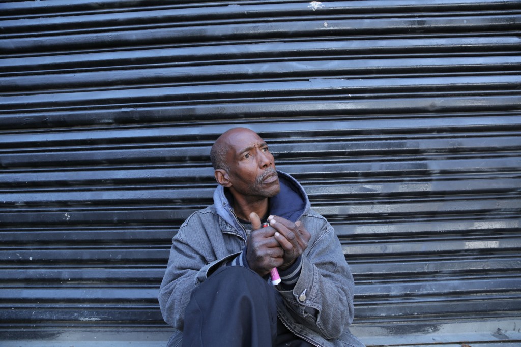 A man who only gave his name as Jerome smokes at a homeless encampment. The encampment coordinator soon asked him to leave the area. According to San Francisco’s 2015 ho reported alcohol or drug abuse, which may cause users to be denied services. (Photos by Gabriella Angotti-Jones)