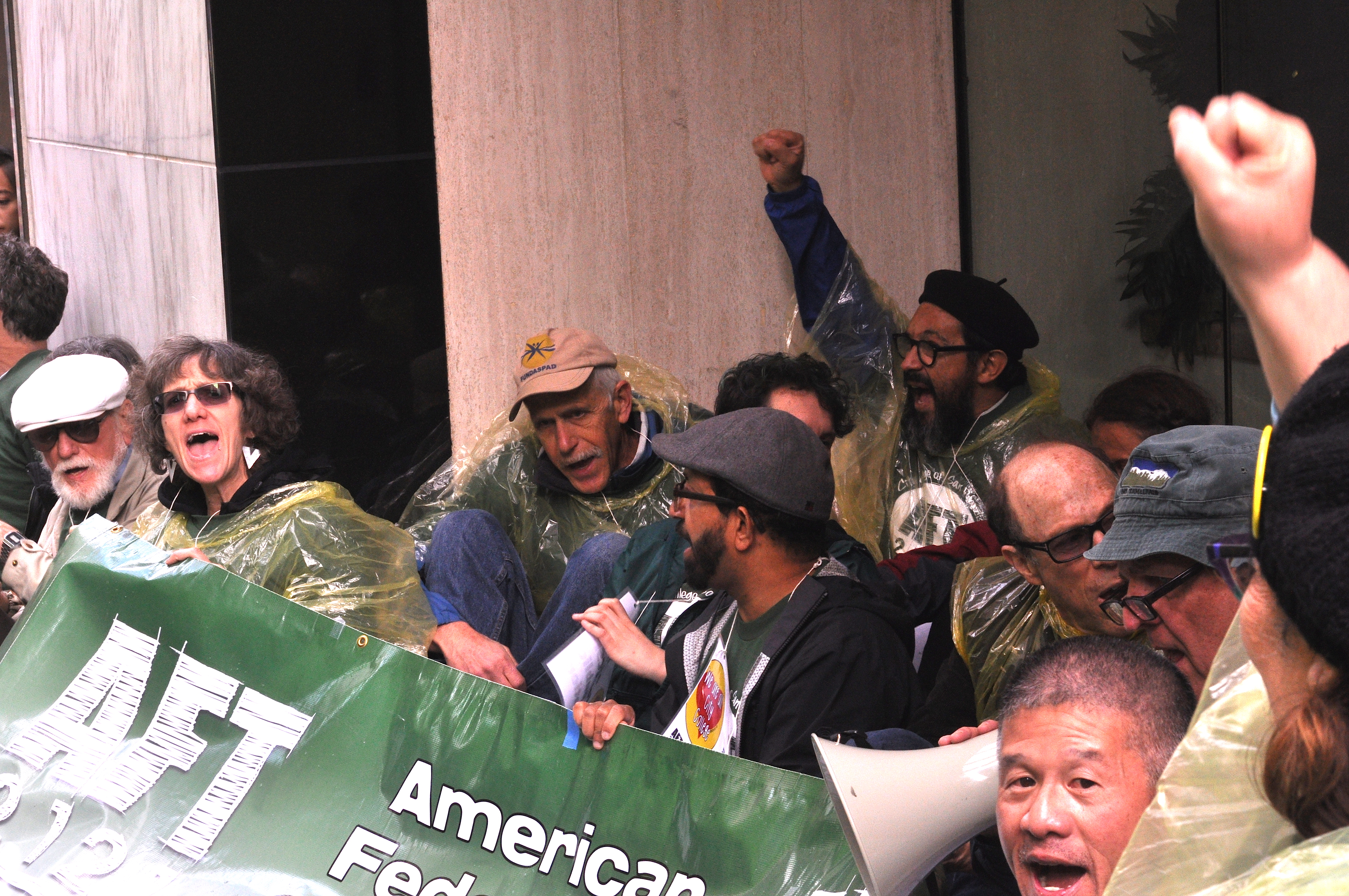 More than two dozens teachers, counselors, librarians and educators block the doors to the office City College's lead contract negotiator in an act of civil disobedience during a rally and march on March 11, 2016. (Photo by Bridgid Skiba/contributor to The Guardsman) 