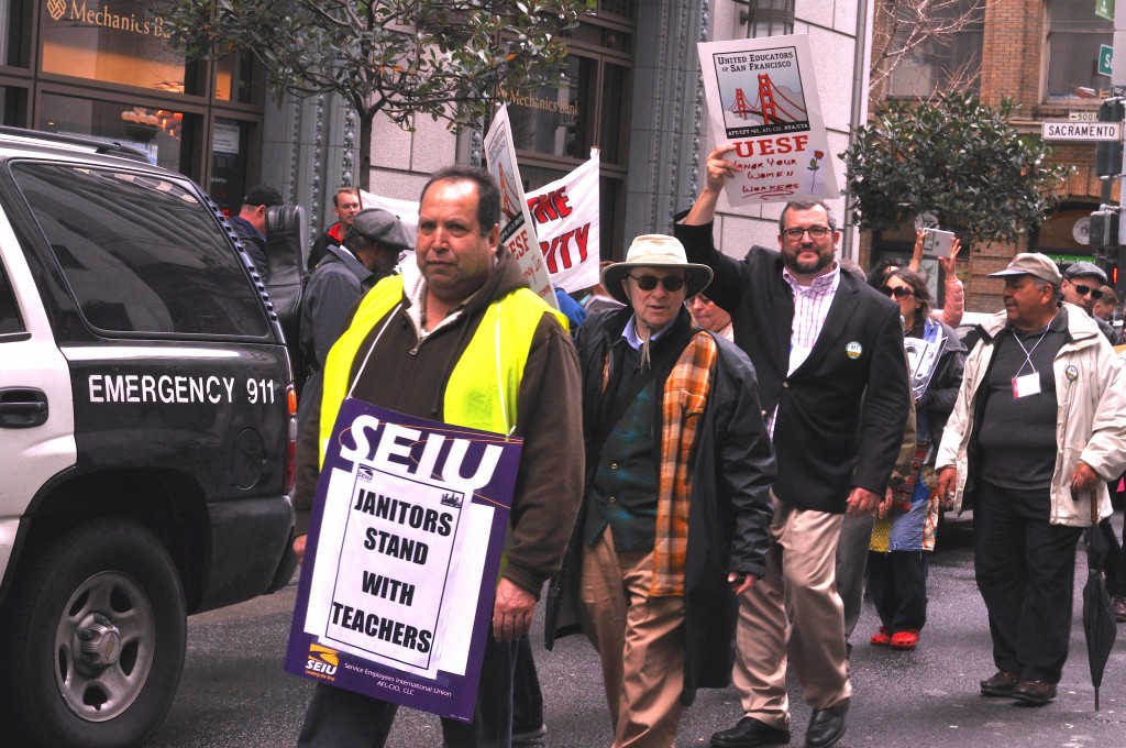 City College janitors unite in solidarity with supporters for a fair contract during the rally and march in front of the office of Jeff Sloan, City College’s lead negotiator on March 11, 2016. (Photo by Bridgid Skiba/contributor to The Guardsman) 