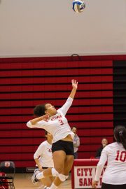 CCSF Rams outside hitter Jennifer Quarters-Styles, freshman, serves during the first set against the Gavilan College Rams at the Brad Duggan gymnasium on September 16, 2016. Photo By Franchon Smith/The Guardsman