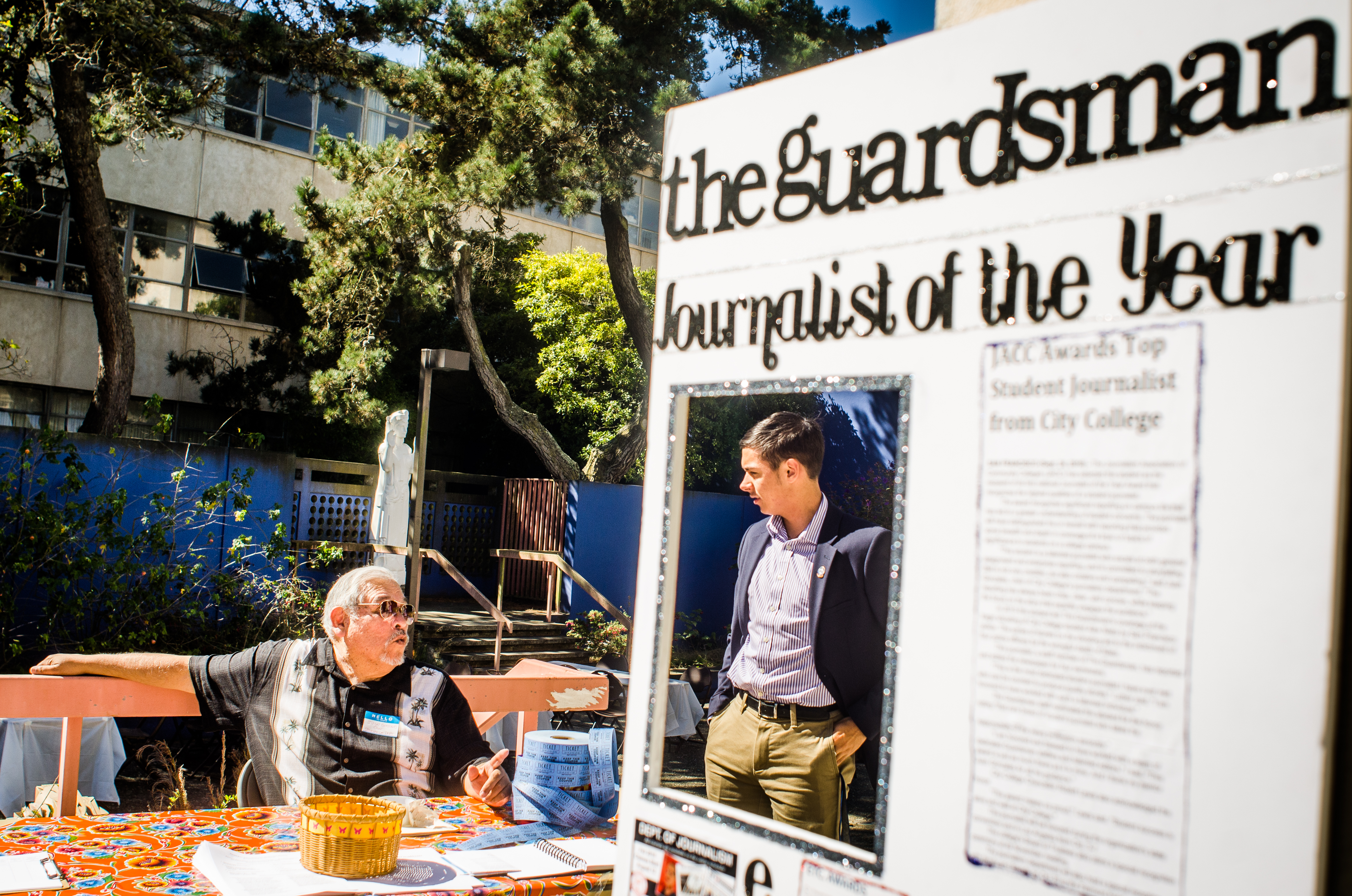 Juan Gonzales, department chair of journalism at City College, speaks with a symposium attendee. (Photo by Gabriela Reni/The Guardsman)