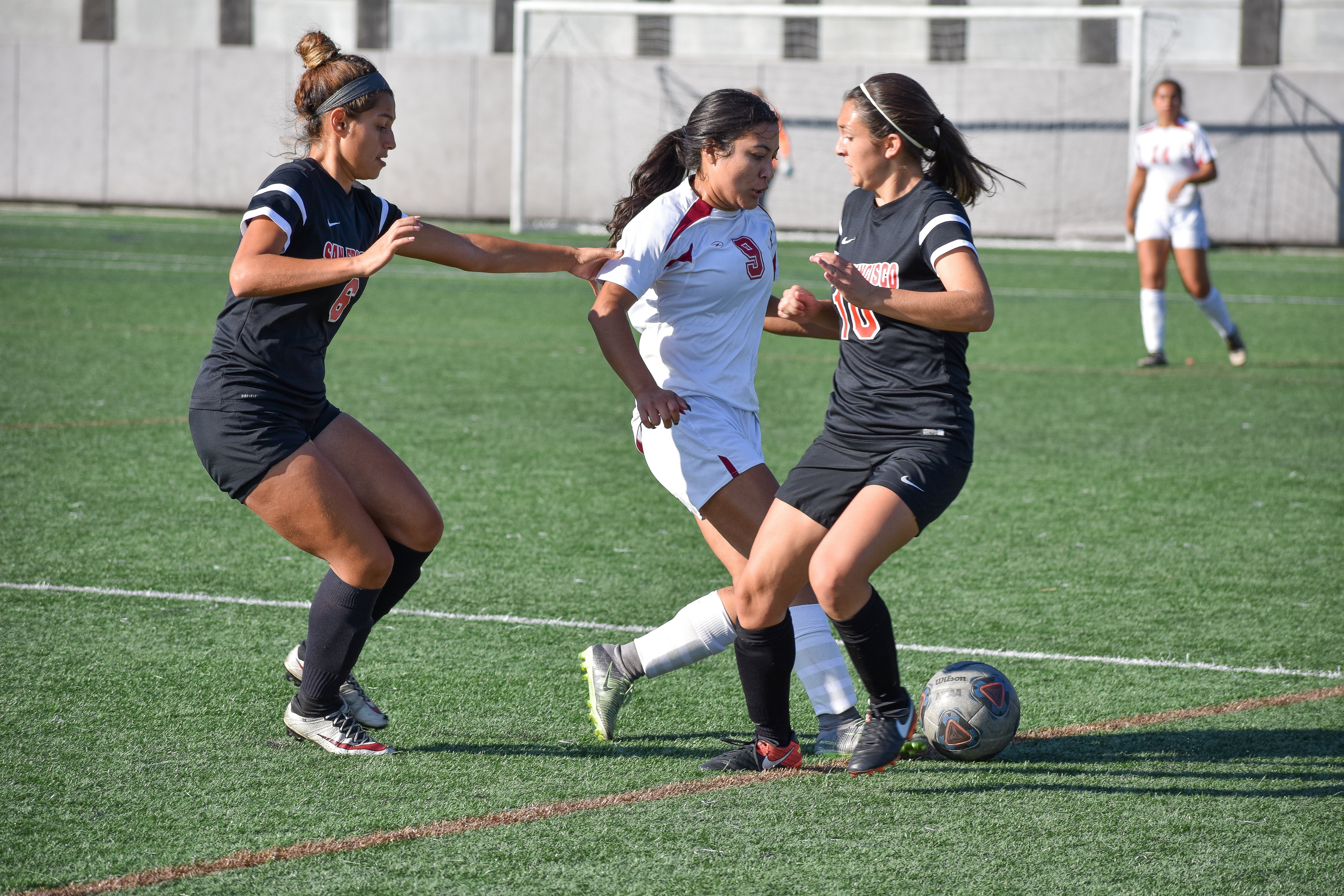 Defenders Chelsea Herrera (#6) and Shannon Garcia (#10) try take away the ball from the opponent. Photo by Julia Fuller. 