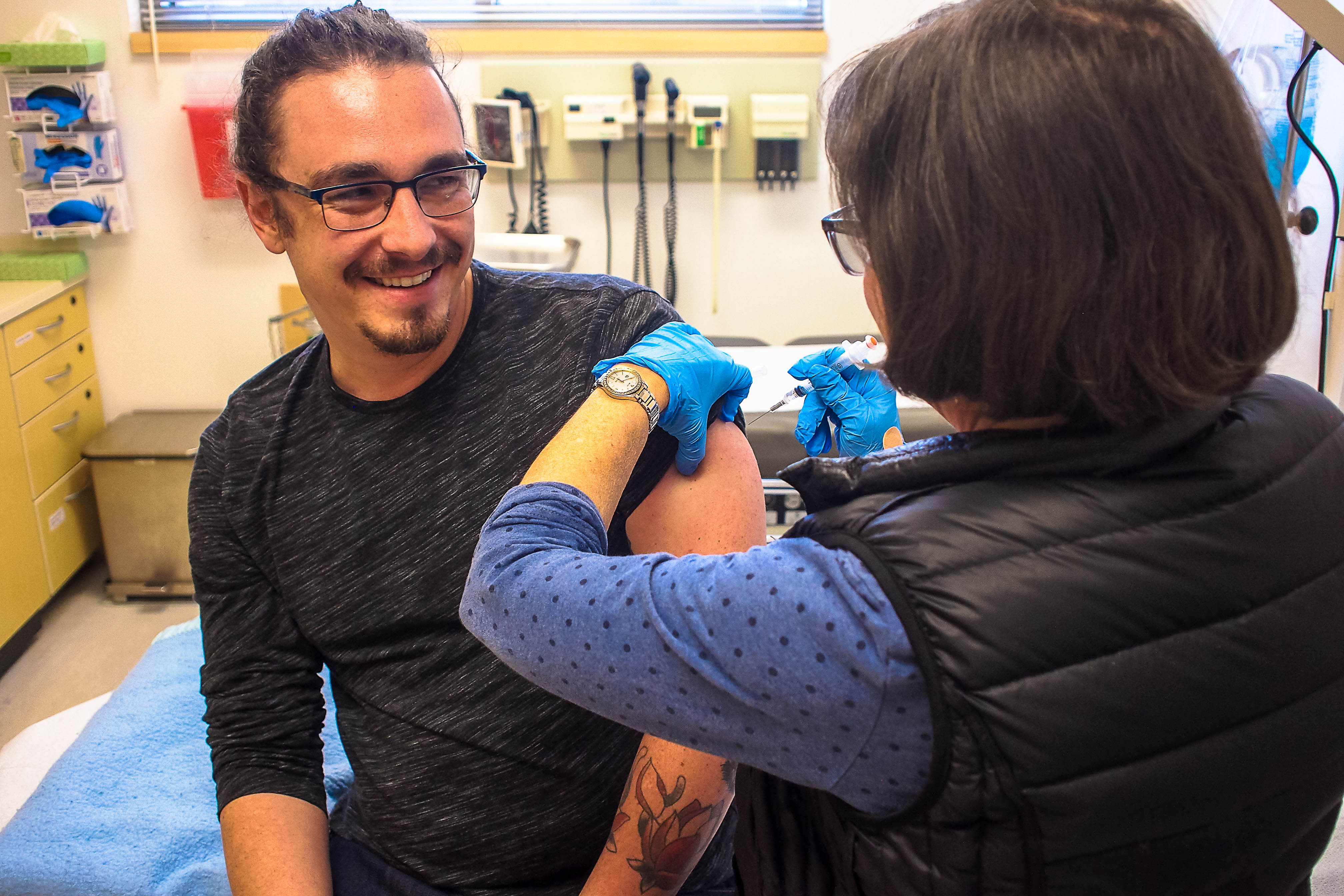 Jan. 24, 2018. Guardsman Reporter Cameron Ehring receiving the influenza vaccine from Nurse Practitioner Paula Cahill at Student Health Services on City College of San Francisco’s Ocean Campus. Photo courtesy of George Martiniano.  