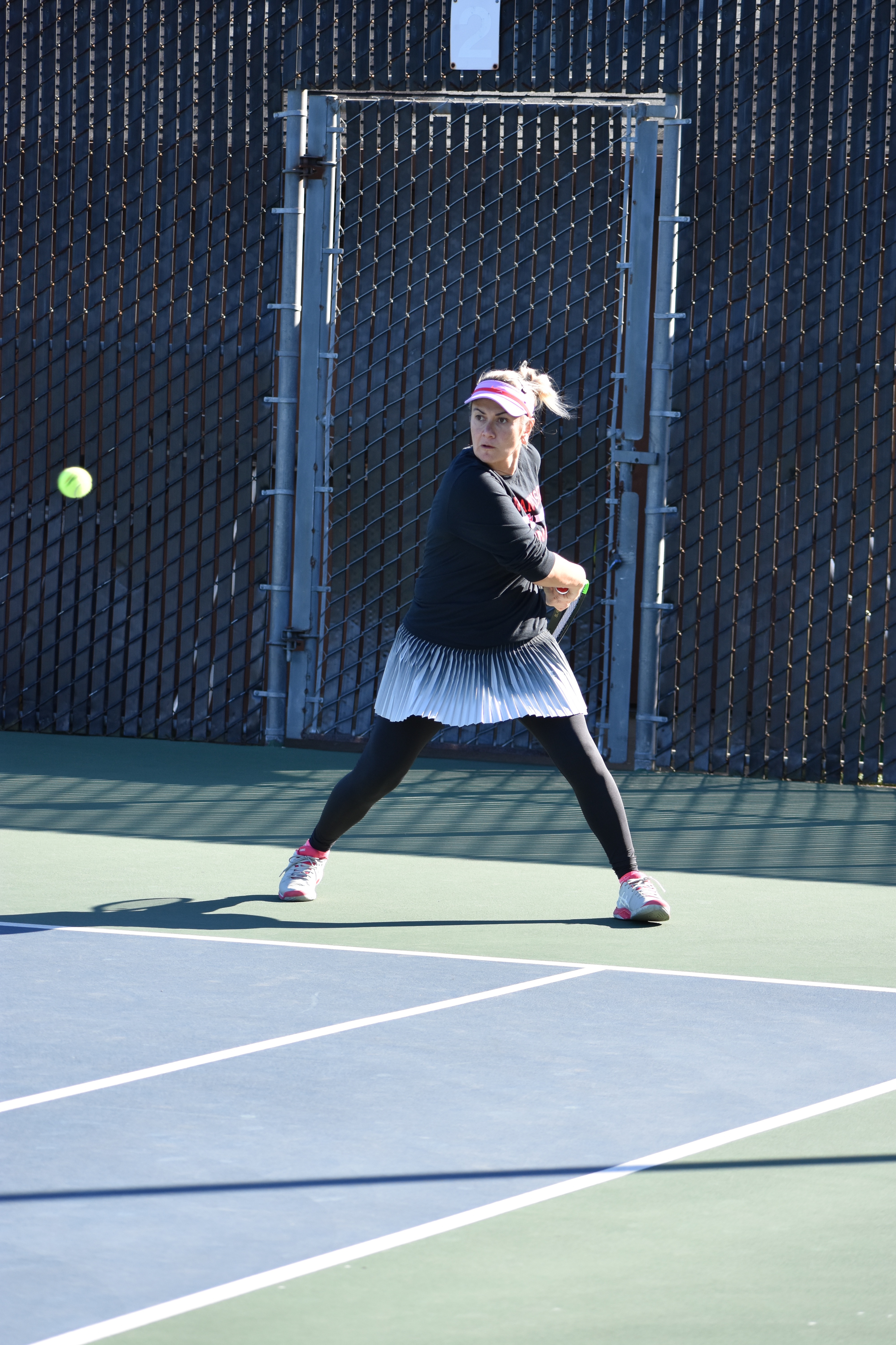 Ram's No. 1 singles player sophomore Zee Aynaci winds up for a backhand response versus Cañada College on Feb. 16, 2018. Photo by Veronica Steiner/The Guardsman. 