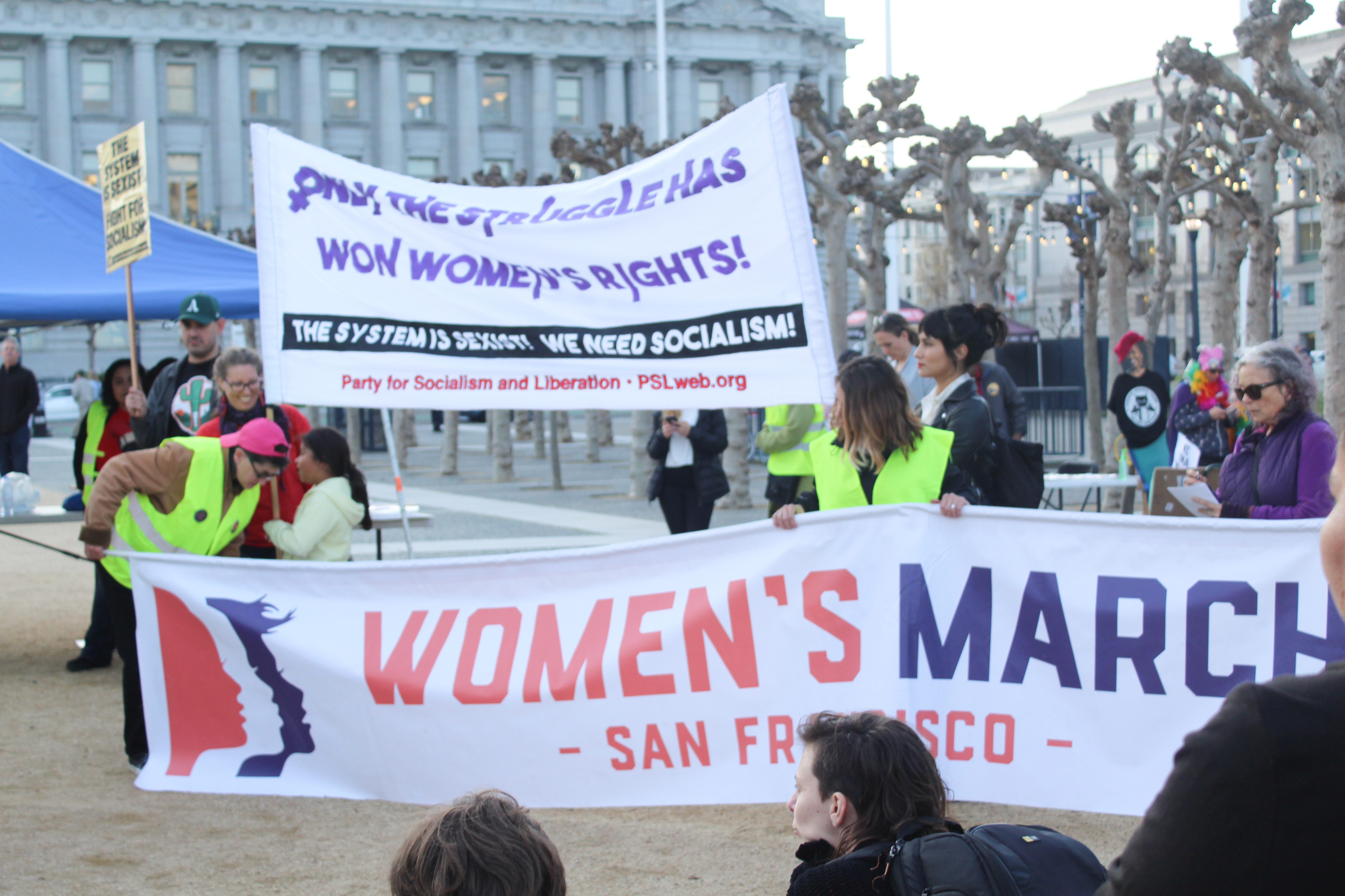 Women's March San Francisco's banners waved in the breeze at  International Women's Day at Civic Center Plaza in San Francisco on March 8, 2018. Photo by Adina J. Pernell/Special to The Guardsman.
