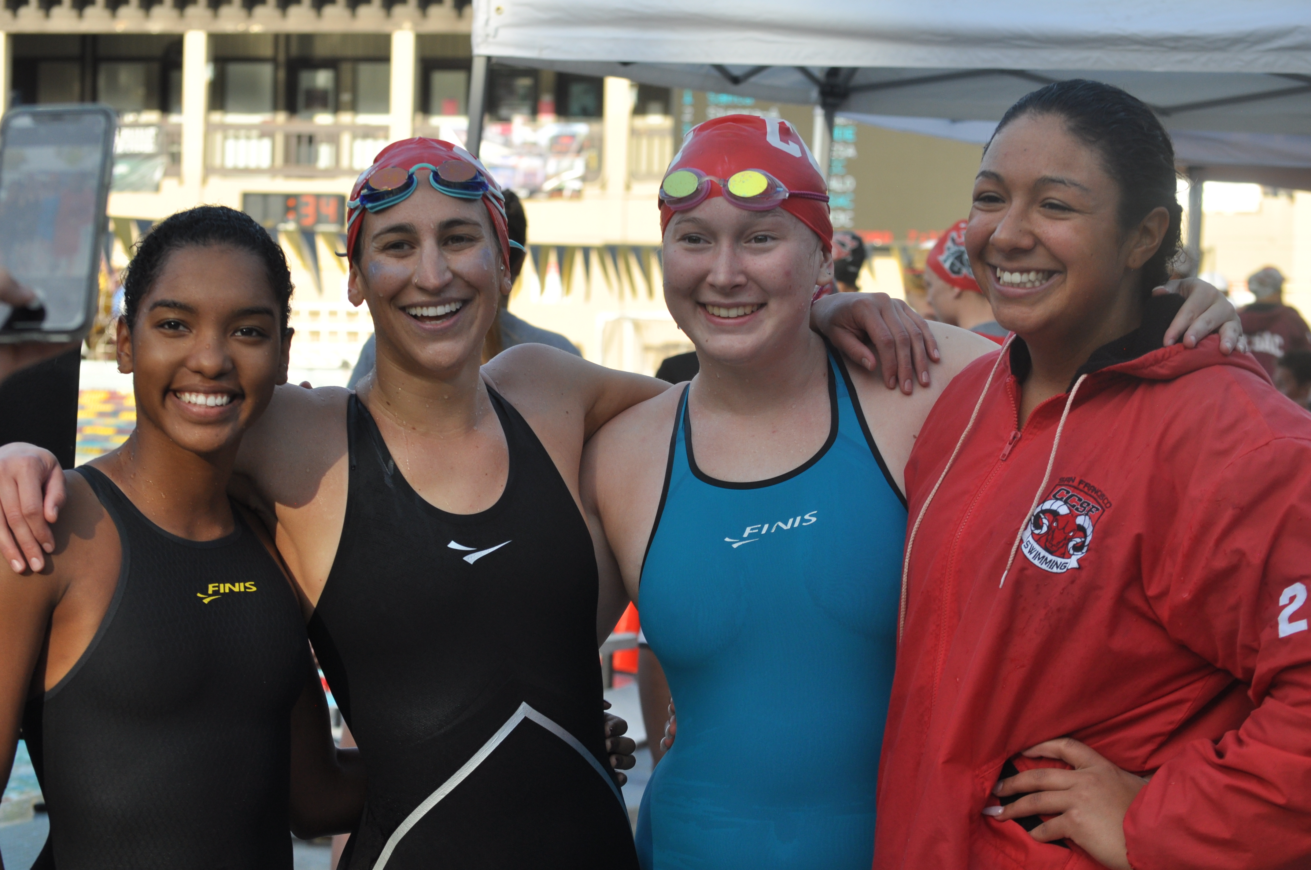 Carla Sakia Hovde, left to right, Bianca Taylor, Keelin Alspaugh, and Julia Lane after competing in the 800 Free Relay at De Anza on May 4, 2018. Photo by Peter J. Suter/The Guardsman.