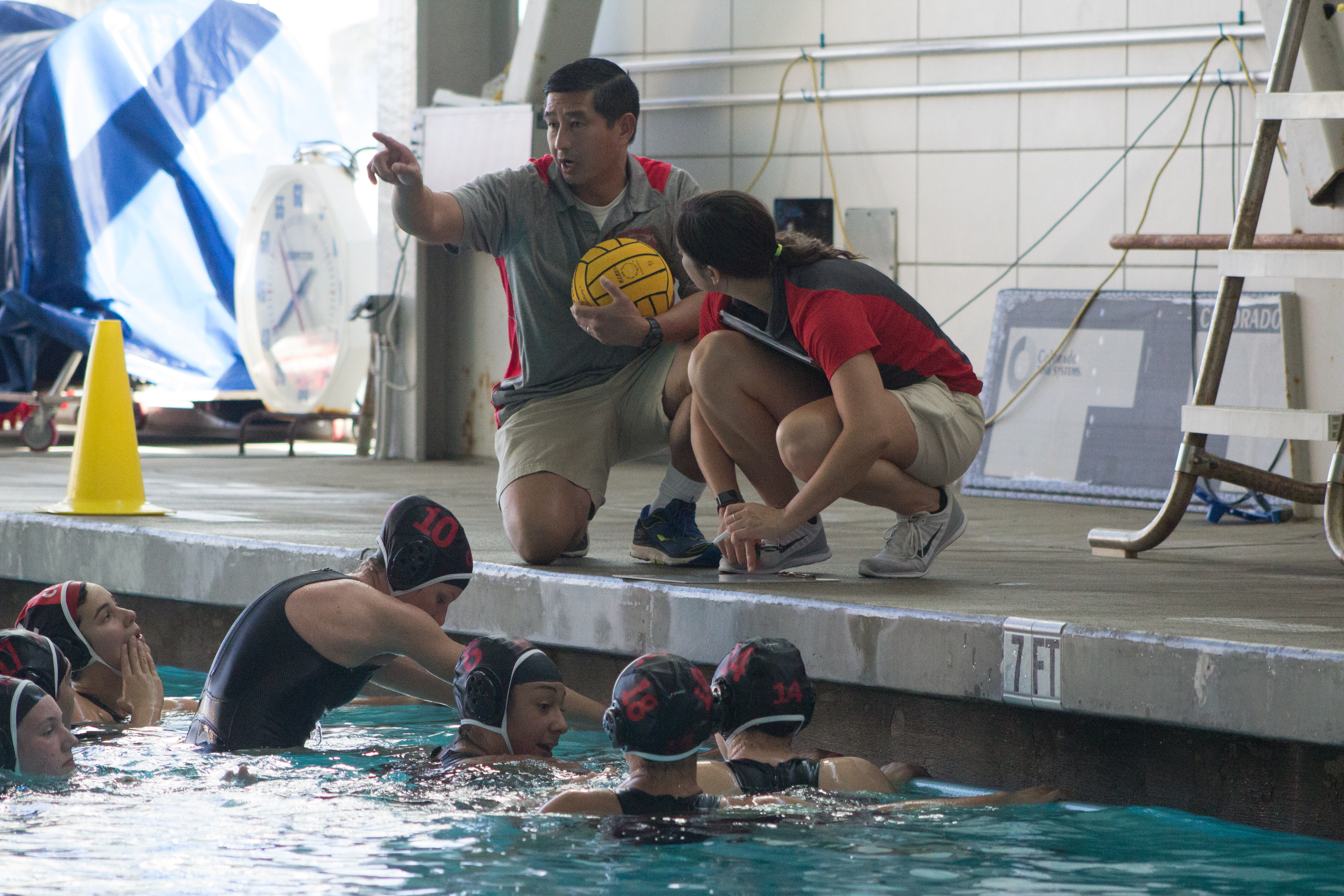 City College Rams Coach Pham and Assistant Coach Natalie Taylor talk with team after time out against DeAnza College on Oct. 5, 2015. Photo by Peter J. Suter/The Guardsman