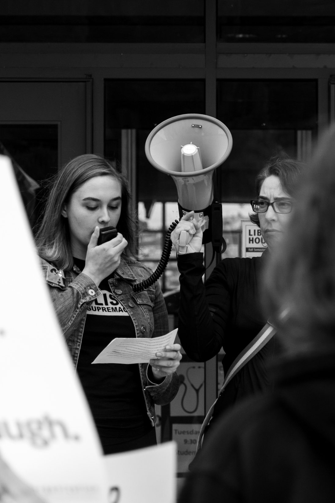 Isabella Hord, left, reads out her statements against Supreme Court nominee, Brett Kavanaugh during the 30 minute speakout that cut through the 12:30 p.m. class break on Wednesday, Oct. 4. Photo by Cliff Fernandes/The Guardsman