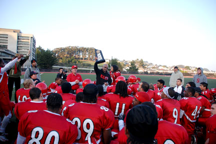 Chancellor Dr. Don Q. Griffin presents the City College Rams football team with the 2009 Hawaiian Punch Bowl Trophy on Dec. 5 after their 59-0 win over American River College. RAMSEY EL-QARE / THE GUARDSMAN