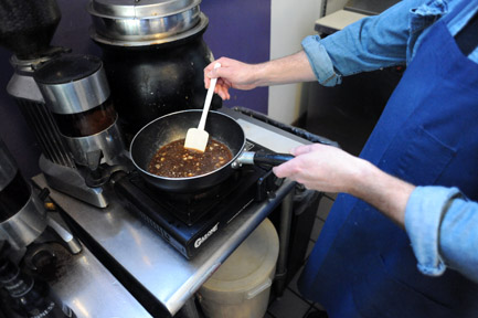 Melt Restaurant owner prepares some fondue. ROBERT ROMANO / THE GUARDSMAN
