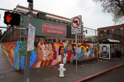 A mural titled "Educate to Liberate" at the corner of Hayes Street and Masonic Avenue frames the recently renovated campus. Infrastructure, brick and cosmetic repairs as well as seismic and electrical upgrades forced some classes at John Adams to move to DeAvila Middle School. ROBERT ROMANO / THE GUARDSMAN