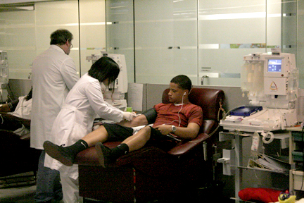 Freshman cornerback Anthony Woods prepares to have his blood draw at Blood Centers of the Pacific Irwin Center in San Franciscon on March 17. AARON TURNER / THE GUARDSMAN
