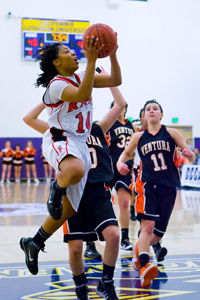 Sophomore guard Brittney Allen goes for a layup against Ventura defenders. Allen scored 25 points against Ventura, leading all scorers. PHOTO COURTESY OF ERIC SUN.