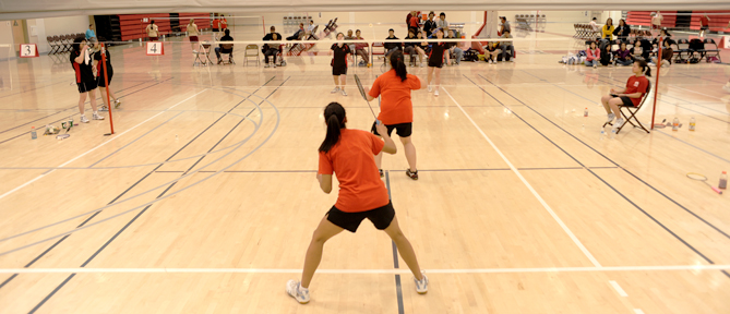 (L-R) City College sophomores Wendy Zhu and Michelle Wu face Skyline's Rachel Bernia and Nour Abudamus in their first-round doubles match during the Northern California Badminton Finals, May 8 at the Wellness Center. ROBERT ROMANO / THE GUARDSMAN