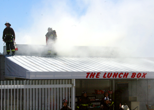 Firefighters douse a small blaze at the Ocean campus Lunch Box on May 6. Investigators suspect arson caused the fire that ignited following an unsanctioned fireworks display launched from the roof of the restaurant just before 11:30 a.m.An "unknown device" from the scene is believed to be the source of the fire, said City College Police Department officer Rachele Hakes. Alex Emslie / The Guardsman Read the full story in the May 12 issue of The Guardsman.
