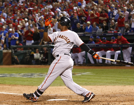 Edgar Renteria of the San Francisco Giants hits a 3-run home run in the seventh inning against Cliff Lee of the Texas Rangers in Game 5 of the World Series at Rangers Ballpark in Arlington, Texas, on Monday, November 1, 2010. (Tom Fox/Dallas Morning News/MCT)
