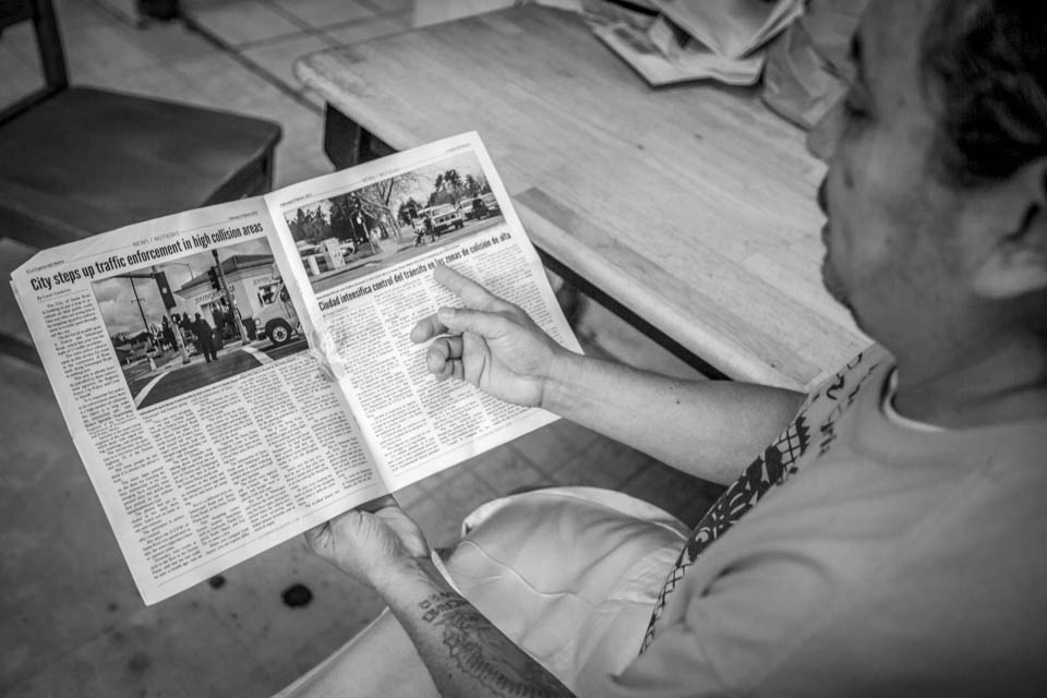 Louie Gutierrez shows an issue of La Espina Del Norte, a bilingual newspaper he published in Santa Rosa on Friday, Aug. 29 at La Reyna Bakery at 3114 24th Street in the Mission, San Francisco. (Photo by Nathaniel Y. Downes) 