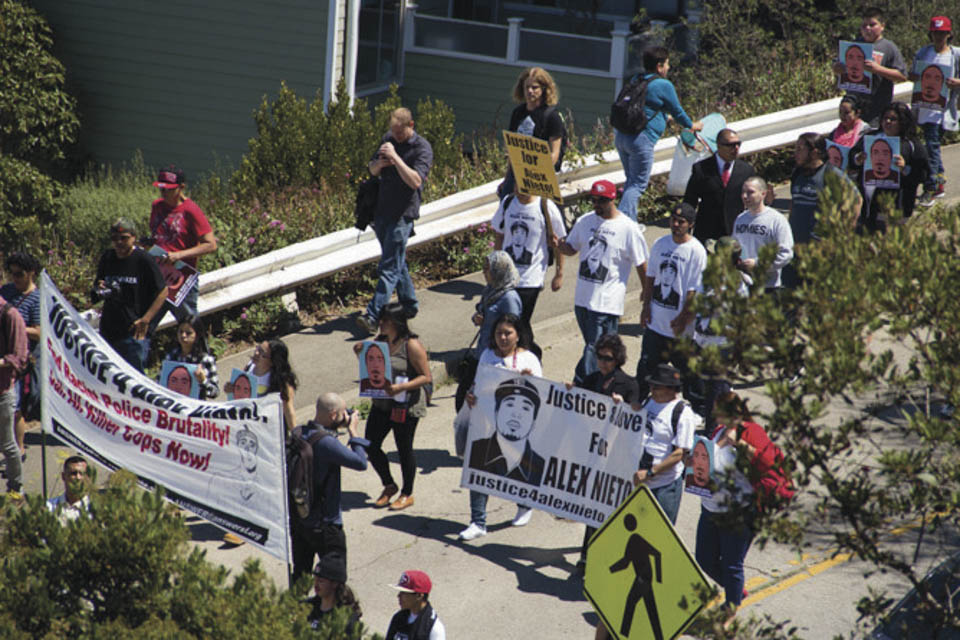 Friends, family and community members march from the Alex Nieto Memorial at Bernal Heights Park to  The Phillip Burton Federal Building & United States Courthouse at 450 Golden Gate Avenue in San Francisco to honor Alex Nieto on the 5-month anniversary of his death on Aug. 22, 2014. (Photo by Khaled Sayed)  