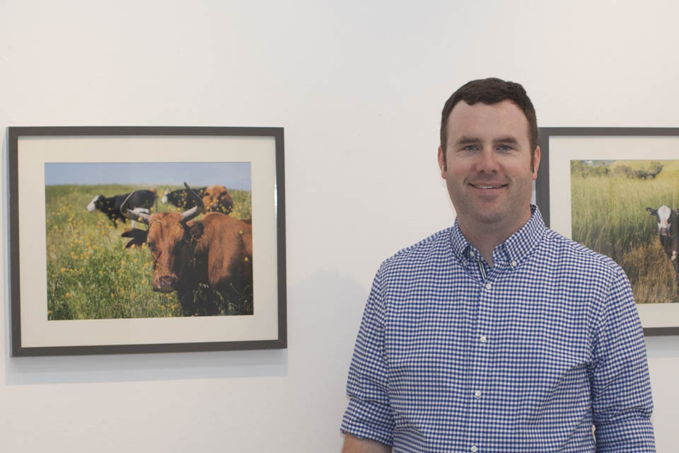 Brian Churchwell celebrates the opening reception of the Orinda Cattle exhibit on Oct. 8 at City College’s Gallery Obscura. (Courtesy photo by Steven Churchwell)