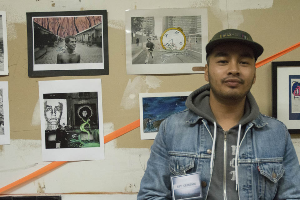 Reynaldo R. Cayetano Jr. San Francisco local and head organizer of Inks of Truth, a San Francisco based collective of photographers and artists which include current and former CCSF students, shows his work in the space that used to be the old San Francisco Barber College, located at 64 6th Street, San Francisco.  “We’ve been doing shows down here on 6th street since 2009, and this is our third time doing the art walk on 6th street,” he explained on Friday, Oct. 10. (Photo By: Niko Plagakis)