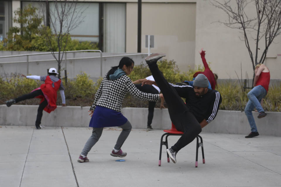 (L-R) Trolley Dancer Joyce Kushner and Franciscoo Arroliga rehearse in front of The Ocean Campus Wellness Center, Friday, Oct. 10. (Photo by Natasha Dangond)