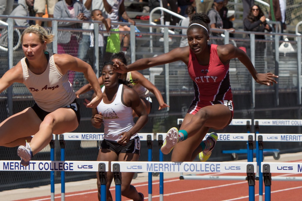 Kiera Simmons coming in a close 2nd in Women 100M hurdle, missing 1st by 0:25 seconds. Maurice Compton Invitational Oakland, Sat., Apr. 10. Photo by Peter Wong