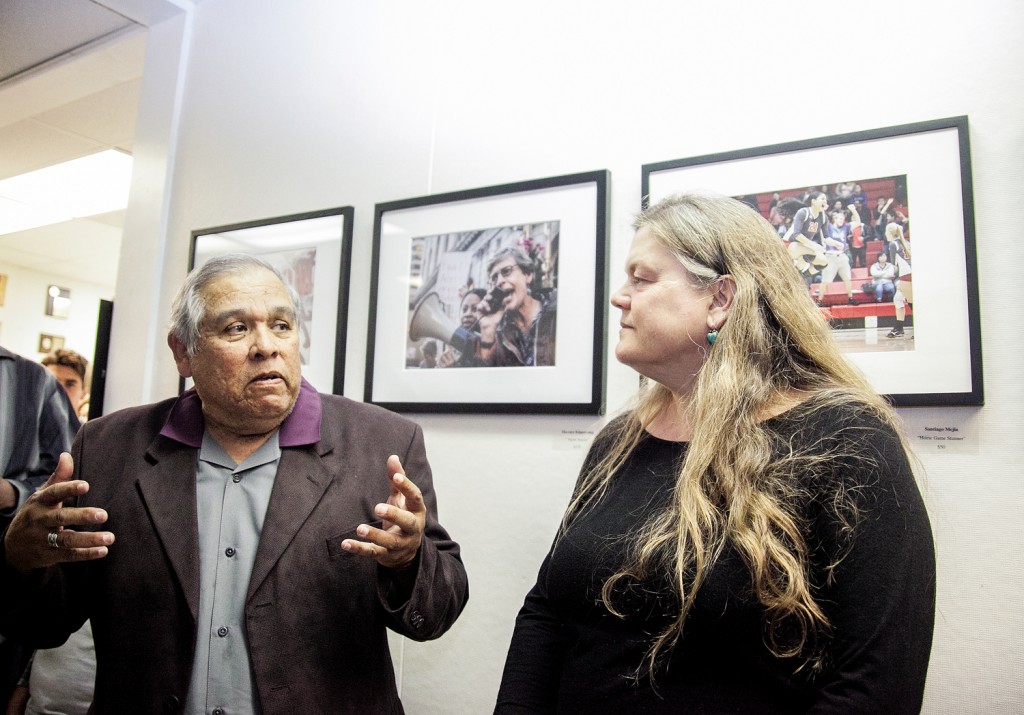 (L-R) Department of Journalism Chair Juan Gonzales and San Francisco Chronicle Director of Photography Judy Walgren, give speech to gallery attendees during photo exhibition’s opening reception in the Front Page Gallery, Ocean Campus on Thursday, April 23. (Photo by Ekevara Kitpowsong)
