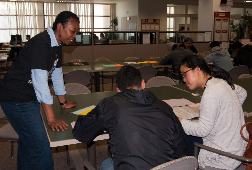 During Frisco Day, Felita Clark from the counseling department and the African American Scholastic Programs checks in on students filling out forms during the application process on Friday, April 24 (Photo by Franchon Smith)