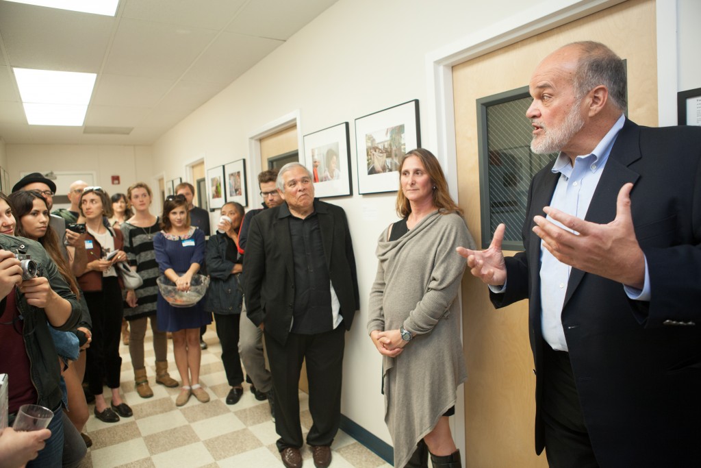 (R-L) Special guest, Pulitzer Prize winning photojournalist and San Francisco State professor of Photojournalism Kim Komenich, featured artist Jessica Lifland, and City College Journalism Department Chair Juan Gonzales, speak to the attendees during the opening reception for “Faces of Hope” at Front Page Gallery on Thursday, Sept. 17, 2015. (Photo by Ekevara Kitpowsong/The Guardsman)