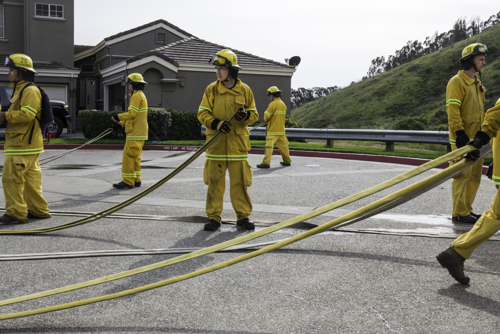 Fire cadets from City College’s Fire Fighter One Academy’s Class 15 prepare hoses for storage and transport after a long day of wildland training at San Bruno Mountain State Park on Saturday, March 21, 2015. (Photo by Nathaniel Y. Downes/The Guardsman)