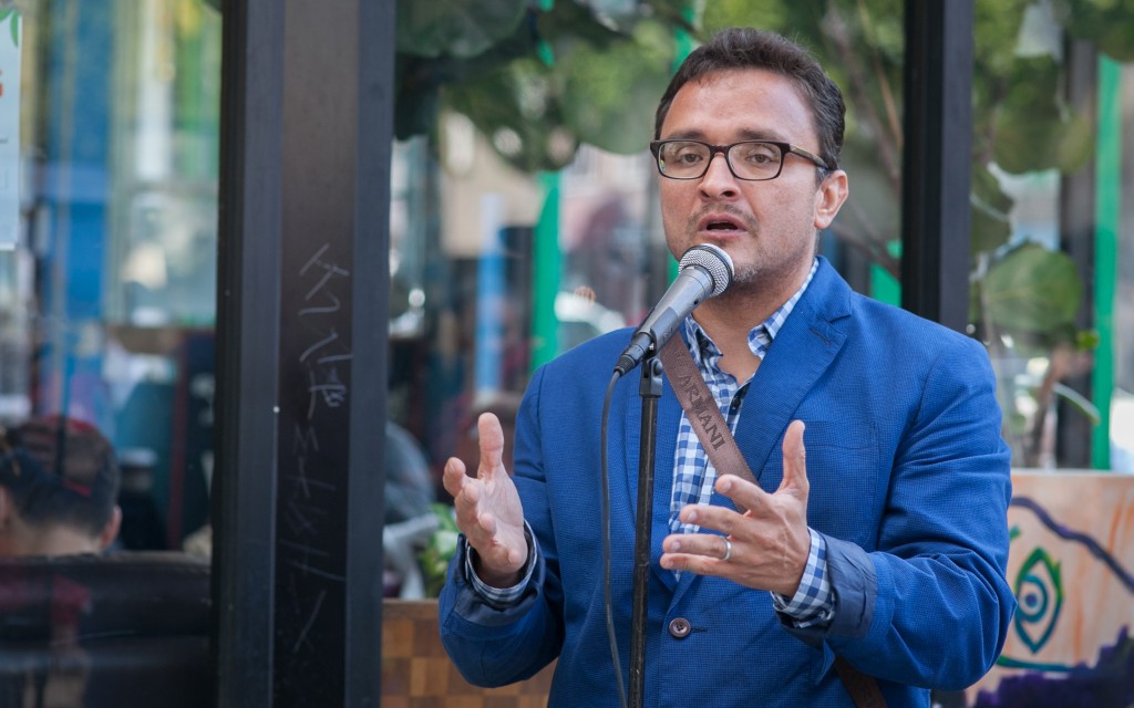 District 9 Supervisor David Campos speaks to the crowd during the celebration of the mural project, which completed by Precita Eyes Muralists Association and Center at the corner of 24th and Folsom streets, San Francisco on Saturday, Aug. 8, 2015. (Photo by Ekevara Kitpowsong/TheGuardsman)