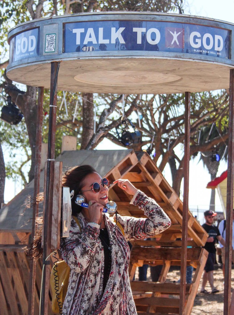  The “Talk to God” phone booth, an interactive art installation, was created by the Ojai Bureau of Pleasure for Burning Man in 2002. The two-way phone line between the “God Throne” and phone booth connects two strangers in conversation. (Photo by Calindra Revier/The Guardsman)