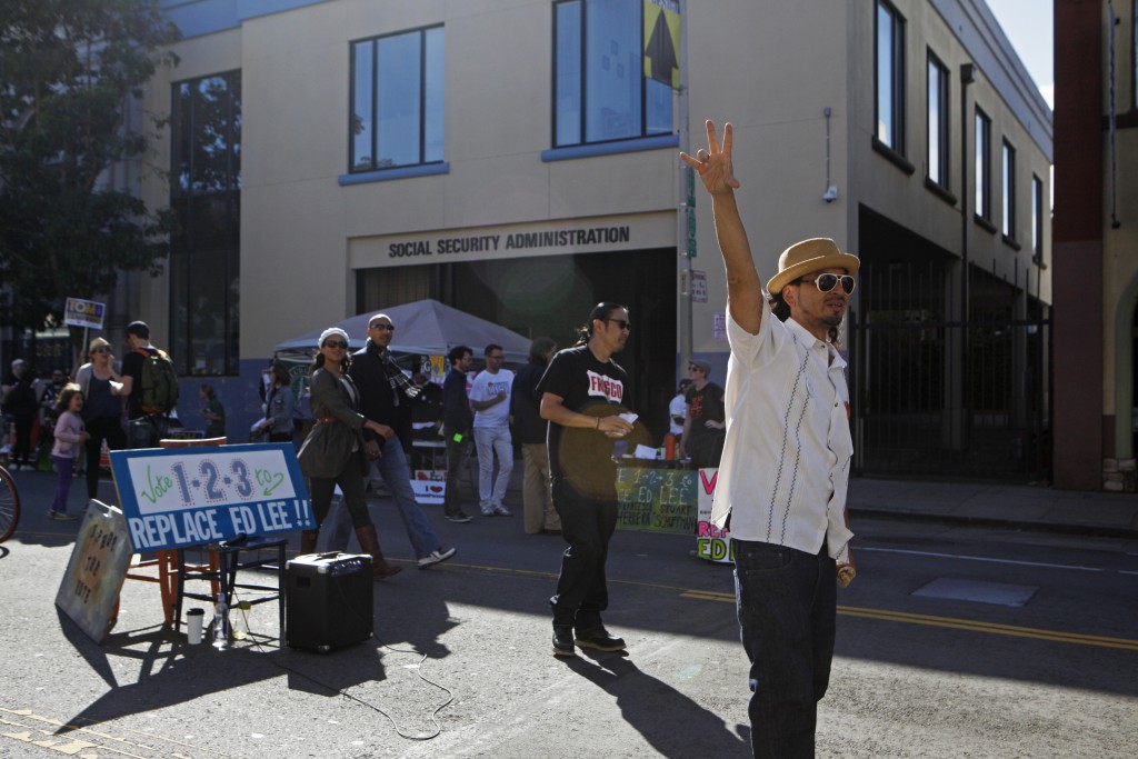Local rapper and former City College student Equipto (right) shows his support for the “Vote 1-2-3 To Replace Ed Lee” campaign during Sunday Streets on Valencia and 22nd Streets on Sunday, Oct. 18, 2015. (Photo by Franchon Smith/The Guardsman)