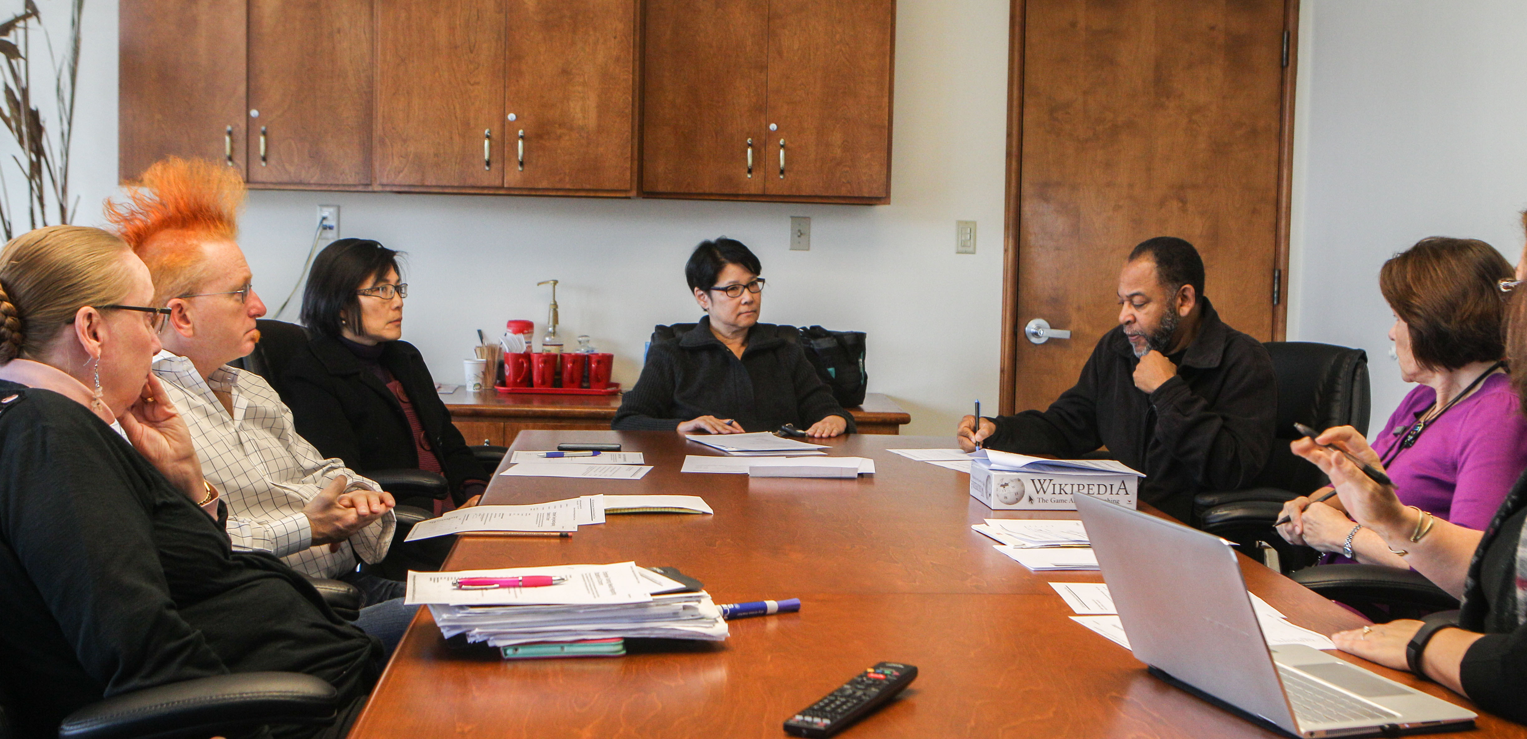College Assessment Intervention and Response Team (CAIR) members meet at Conlan Hall on November 30, 2015. From left: Anne Mayer, faculty, James Rogers, Classified Senate, Minh-Hoa Ta, Dean of Chinatown North Beach Center, Jill Yee, Dean of School of Behavioral and Social Sciences and Multicultural Studies, Chief of Police Andre Barnes, and Becky Perelli, Dir. Of Student Health Services. (Photo by Franchon Welch/ The Guardsman)