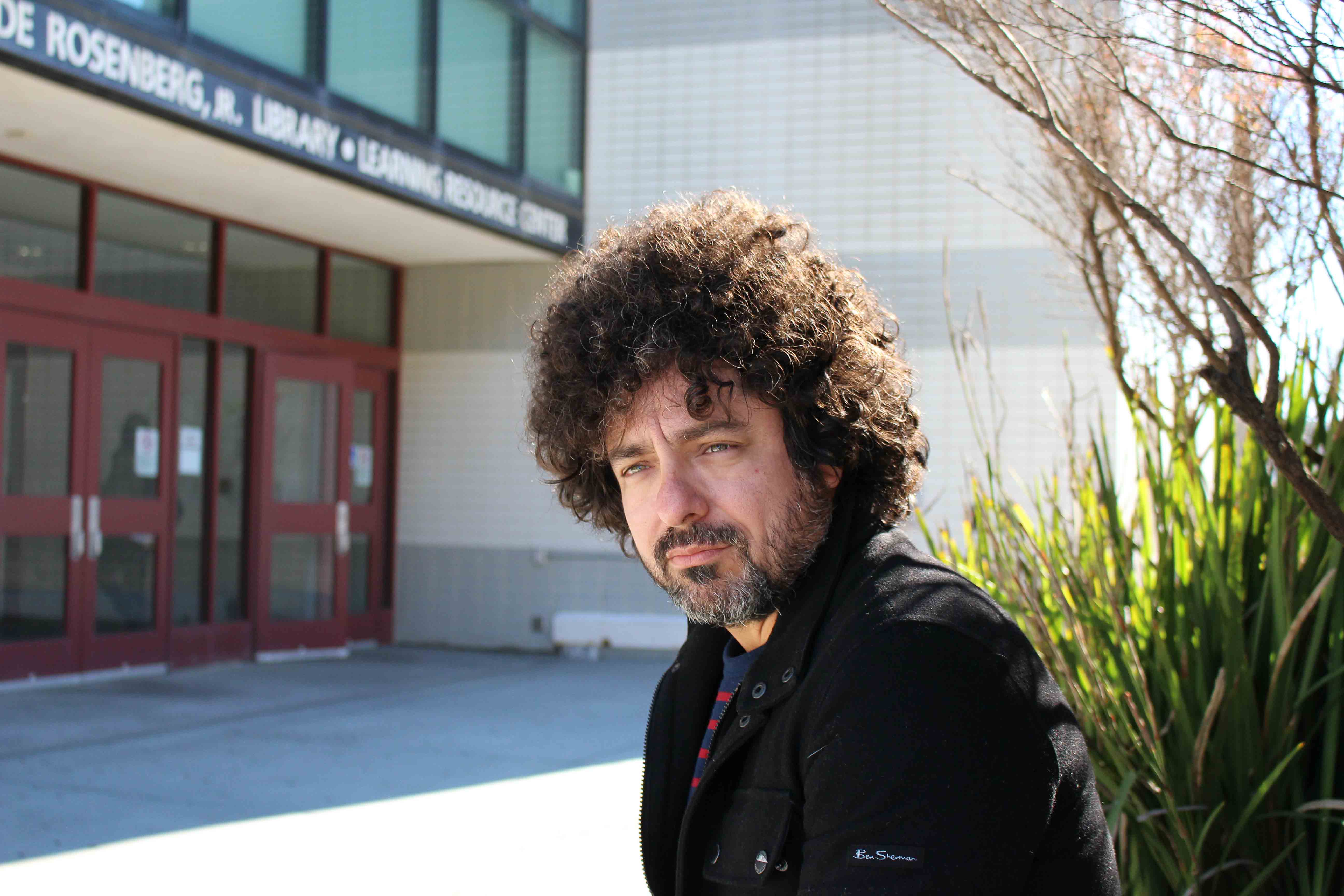 Musician, stand-up comedian, and City College philosophy instructor Michael Morales, outside the Rosenberg Library at Ocean Campus on Monday Nov. 16, 2015. (By Shannon Cole/The Guardsman)