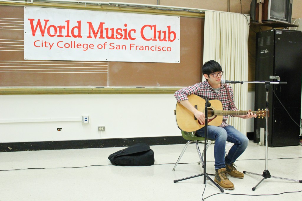 Lelouch Lam sings and plays a Chinese song on guitar during the World Music Club’s Singing Contest on Friday, Nov. 20, 2015. (By Shannon Cole/ The Guardsman)
