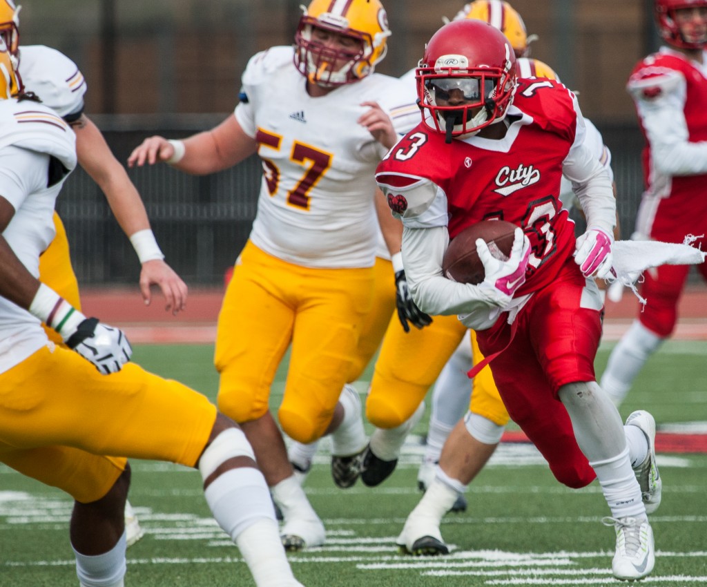City College’s Namane Modise (RB) (13) breaks through Saddleback College defense during the California Community College state championship game at Rush Stadium on Saturday, Dec. 12, 2015. (Photo by Khaled Sayed/The Guardsman)