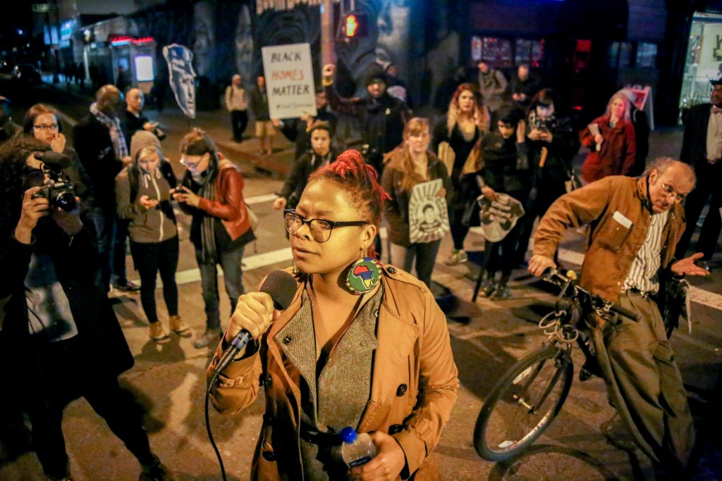 Ronnishia Johnson, a member of Black Lives Matter Bay Area and the Last 3% Coalition speaks to protesters during a demonstration against the displacement of minority communities and to demand justice for the family of Mario Woods in San Francisco on Jan. 15, 2016. (Photo by Joel Angel Juarez/Special to The Guardsman)