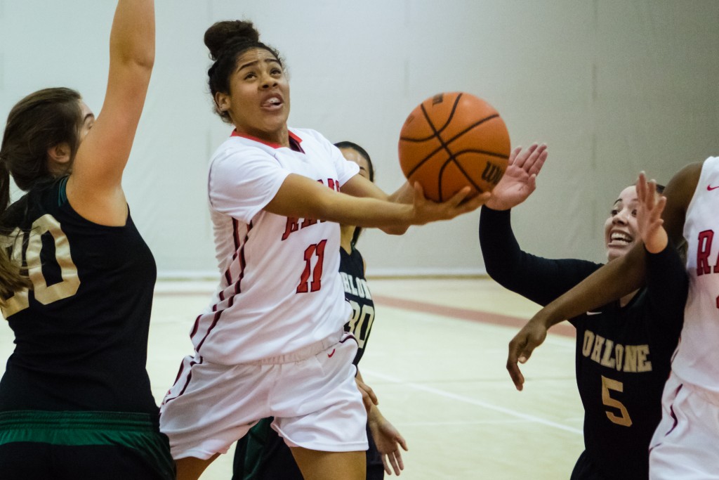 City College freshman guard Gabrielle Vigil (11) drives toward the net against the Ohlone College Renegades on Jan. 20, 2016. (Photo by Peter Wong/Special to The Guardsman)