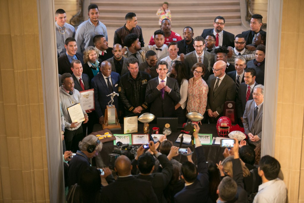 The Rams football team pose for a picture with San Francisco Mayor Ed Lee, Mark Leno, Willie Brown and other officials after being honored for their national champion football program on Feb. 5, 2016. (Photo by Santiago Mejia/The Guardsman)