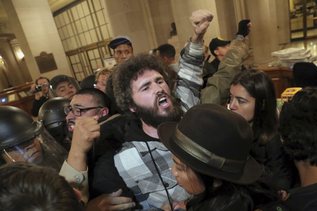 A protester is arrested during a Hunger for Justice SF occupation of City Hall last night. 33 people were arrested. Protesters demanded action against police brutality and for SFPD Chief Suhr to be fired. (Photo by Gabriella Angotti-Jones).