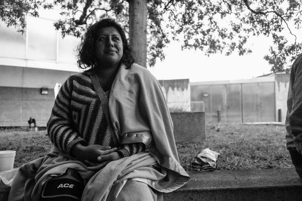 City College Criminal Justice student, Yesenia Cielo, sits with a blanket wrapped around her after being released from county jail. (Photo taken by Natasha Dangond/ Special to The Guardsman)
