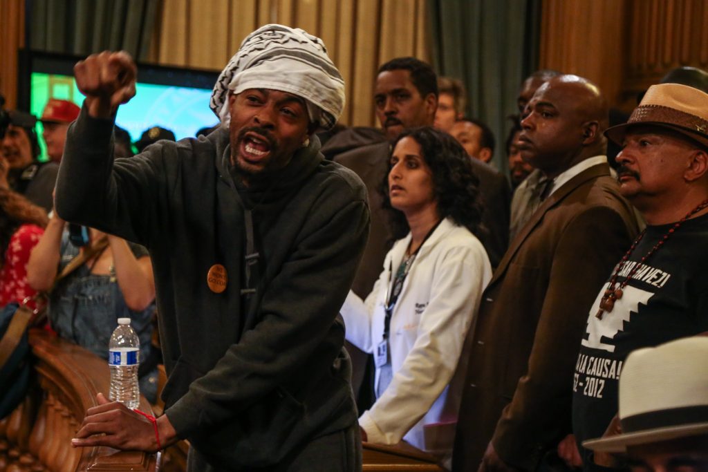 'Frisco Five' striker Sellassie speaks to Board of Supervisors members, demanding action on police brutality and for Chief Suhr to be fired, during a rally inside City Hall. Tues. May 3, 2016, (Photo by Natasha Dangond/Special to The Guardsman)